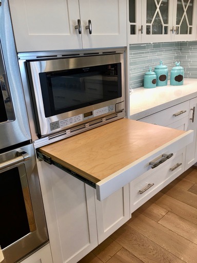 Microwave shelf, tips for kitchen design, landing spaces for kitchens, white shaker cabinets, blue glass backsplash, contemporary kitchen

