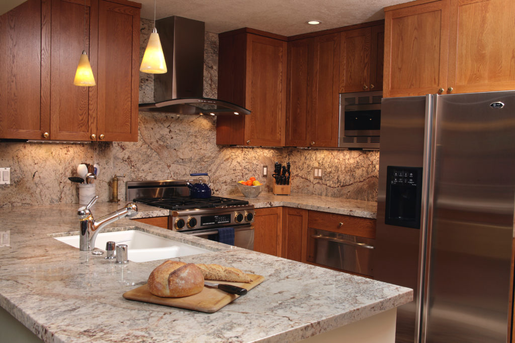 Contemporary condo kitchen, tips for kitchen design, kitchen layout, shaker cabinets, wood cabinetry, granite countertops
